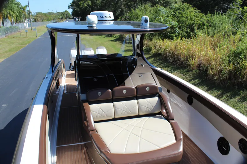 Slide: The Image of 2016 Mystic Powerboats M4200 with luxurious seating and Garmin navigation system. - 16