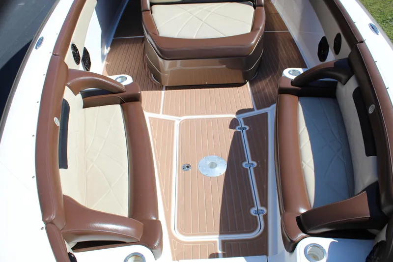 Slide: The Image of 2016 Mystic Powerboats M4200 interior with brown and beige seating and teak flooring. - 17