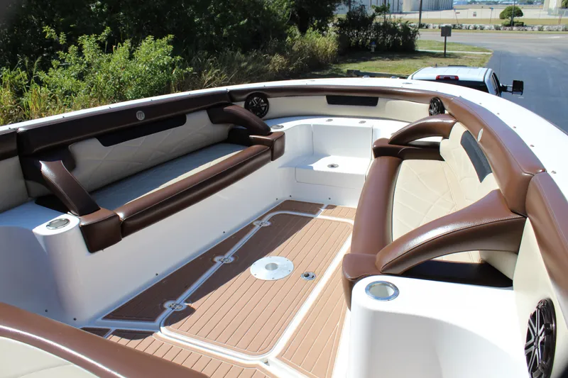 Slide: The Image of 2016 Mystic Powerboats M4200 interior with brown and white seating. - 18