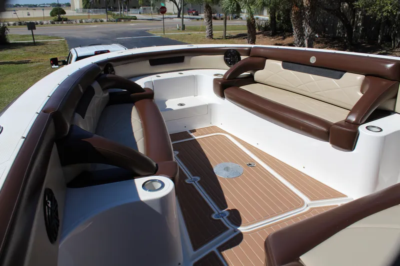 Slide: The Image of 2016 Mystic Powerboats M4200 interior with luxurious seating and teak flooring. - 20