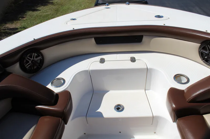 Slide: The Image of 2016 Mystic Powerboats M4200 bow seating area with brown and white upholstery. - 21