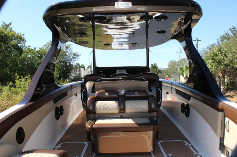 Slide: The Image of 2016 Mystic Powerboats M4200 interior with seating and canopy. - 24