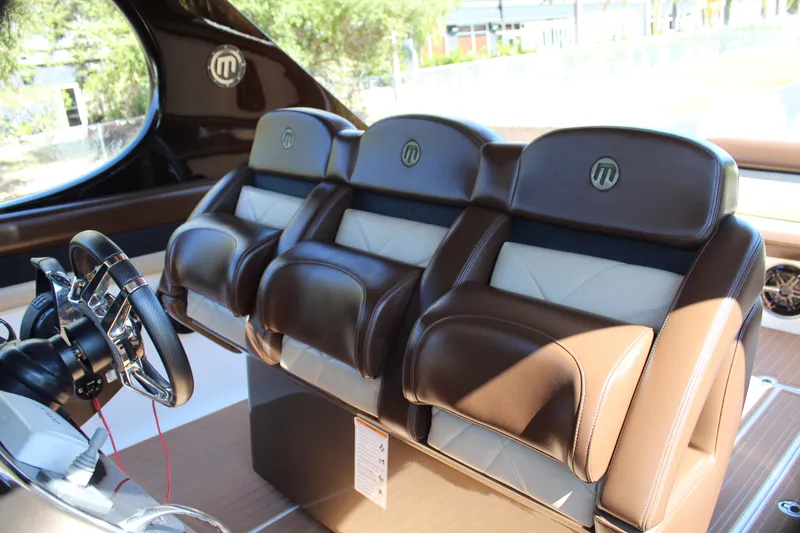 Slide: The Image of Luxurious leather seats in the 2016 Mystic Powerboats M4200 cockpit. - 32