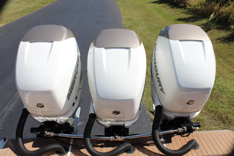 Slide: The Image of 2016 Mystic Powerboats M4200 with triple Mercury outboard engines. - 33