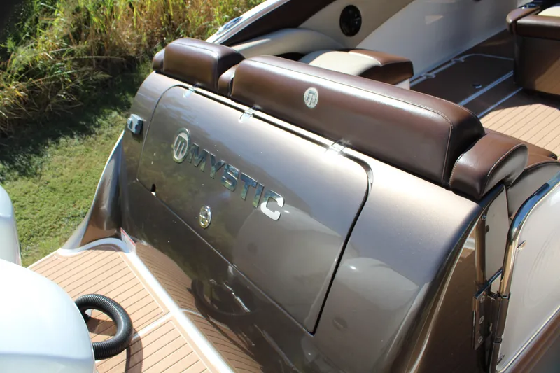 Slide: The Image of 2016 Mystic Powerboats M4200 interior with brown leather seats and sleek design. - 34