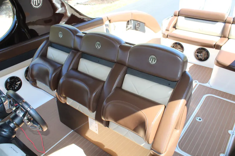 Slide: The Image of 2016 Mystic Powerboats M4200 interior with brown and white leather seats. - 35