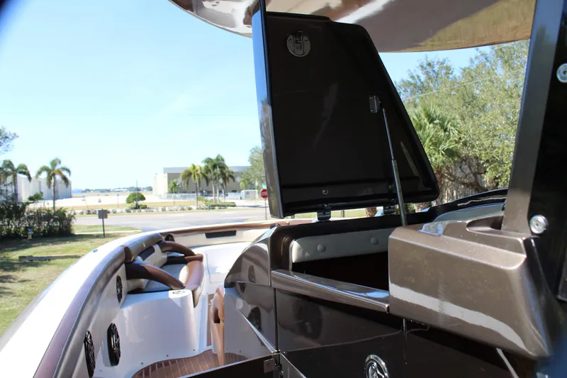 Slide: The Image of 2016 Mystic Powerboats M4200 interior with open storage compartment. - 37