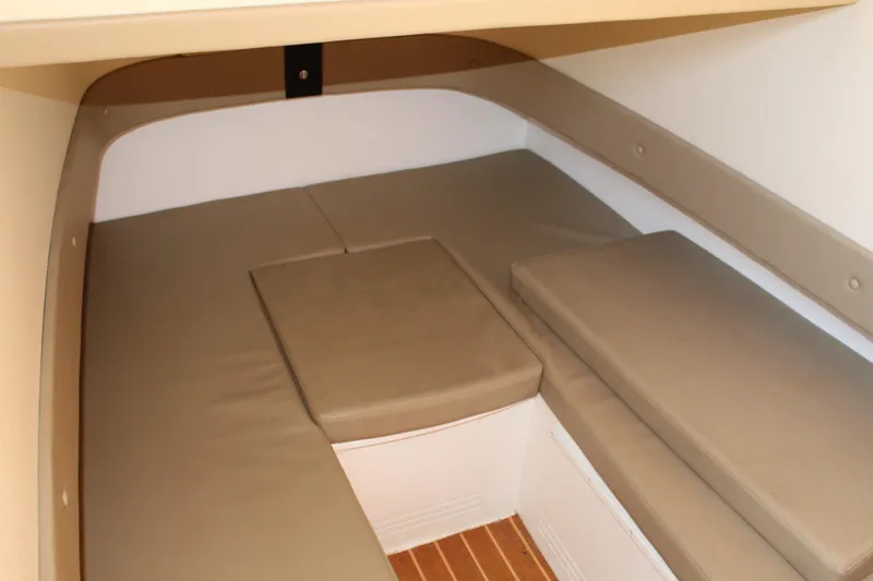 Slide: The Image of 2016 Mystic Powerboats M4200 cabin interior with beige cushioned seating. - 39