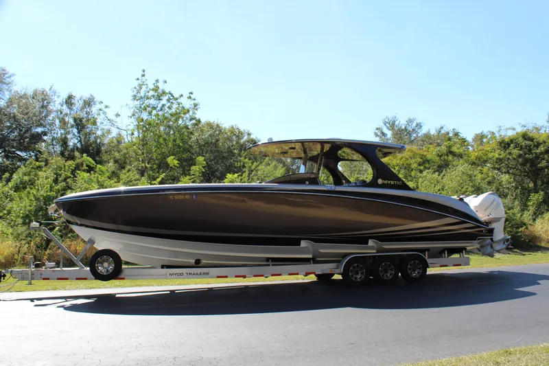 Slide: The Image of 2016 Mystic Powerboats M4200 on a trailer, side view. - 4