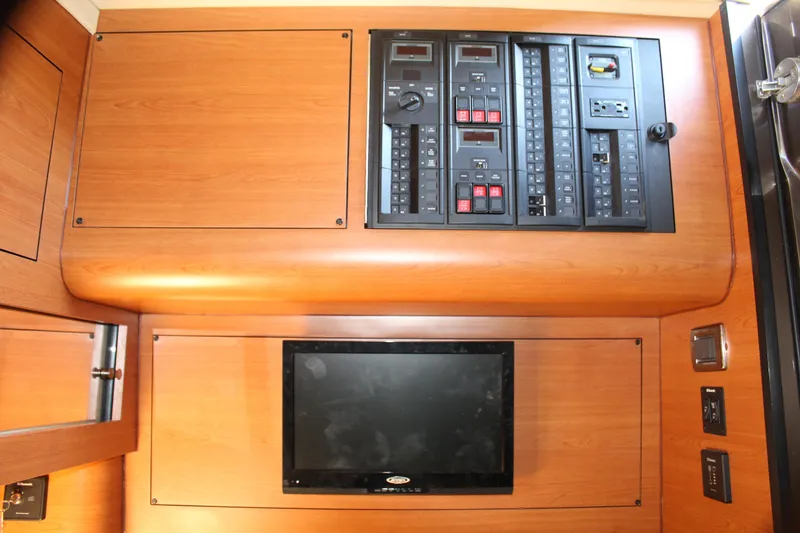Slide: The Image of Control panel and monitor inside a 2016 Mystic Powerboats M4200. - 40