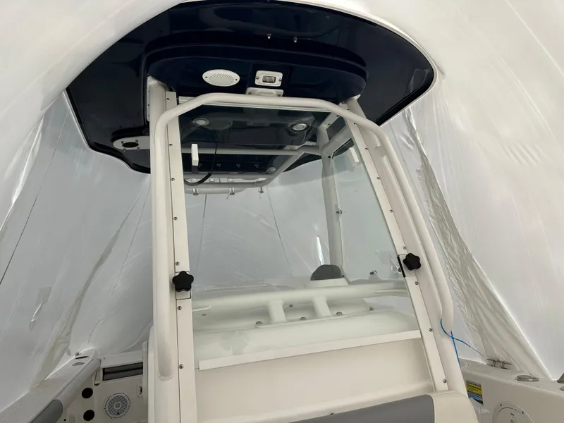 Slide: The Image of 2018 Everglades 230CC center console boat interior under protective cover. - 4