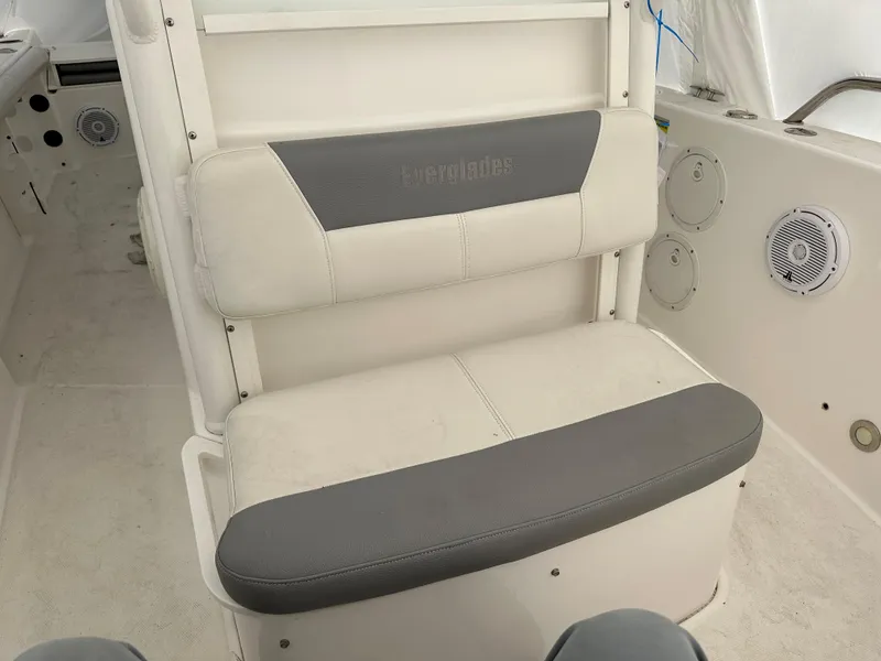 Slide: The Image of 2018 Everglades 230CC boat interior seating with gray and white cushions - 5