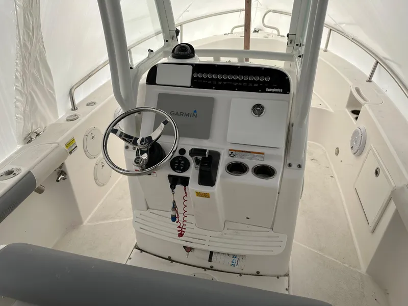 Slide: The Image of 2018 Everglades 230CC boat console with Garmin navigation system and steering wheel. - 9