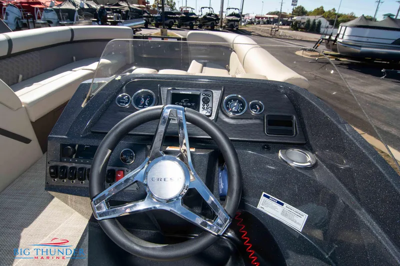 Slide: The Image of 2024 Crest Classic DLX 240 SLC boat dashboard and steering wheel at Big Thunder Marine. - 26