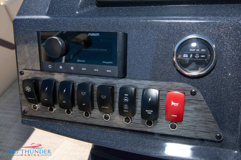 Slide: The Image of Control panel of 2024 Crest Classic DLX 240 SLC pontoon boat with switches and gauges. - 30