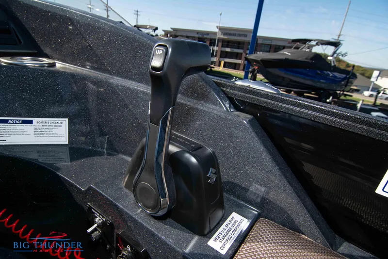 Slide: The Image of 2024 Crest Classic DLX 240 SLC boat throttle control in cockpit. - 31