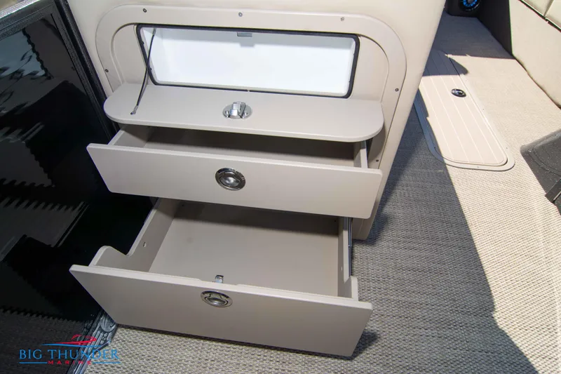 Slide: The Image of 2024 Crest Classic DLX 240 SLC boat interior storage drawers. - 35