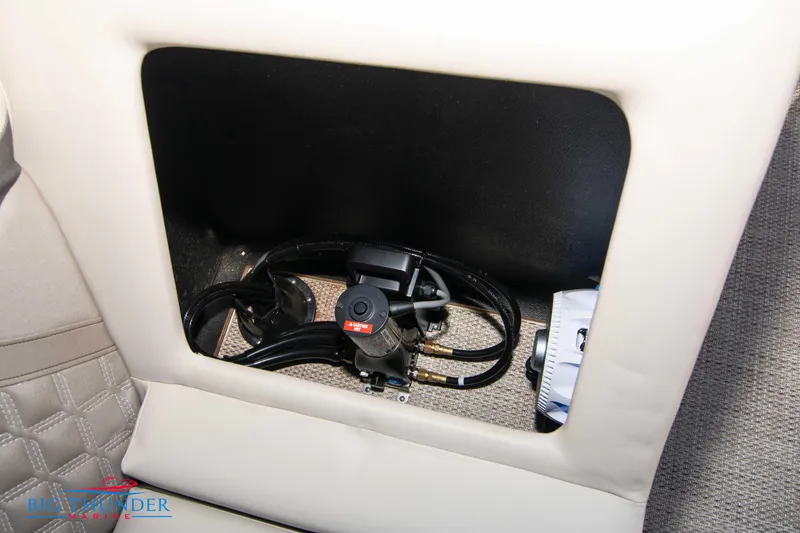 Slide: The Image of Storage compartment in 2024 Crest Classic DLX 240 SLC boat. - 44
