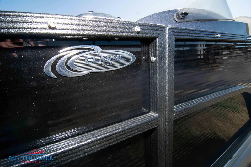 Slide: The Image of 2024 Crest Classic DLX 240 SLC boat exterior close-up with logo. - 7