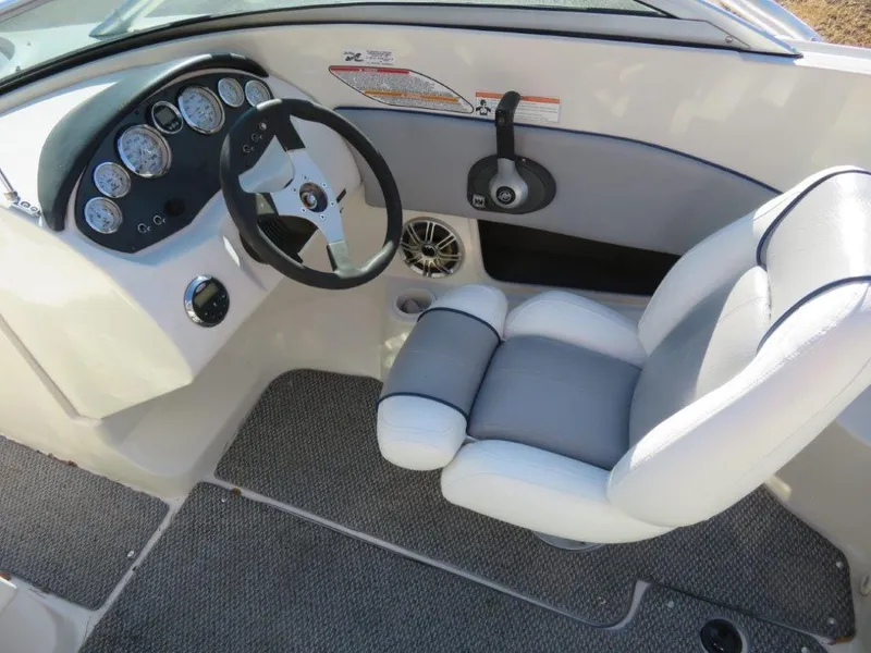 Slide: The Image of 2008 Sea Ray 195 Sport boat interior with steering wheel and gauges. - 3