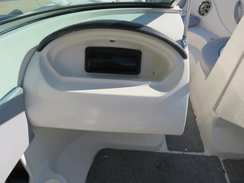Slide: The Image of 2008 Sea Ray 195 Sport boat interior with dashboard and speaker detail. - 6