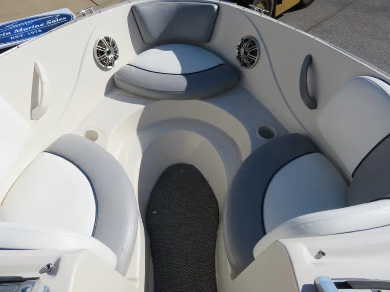 Slide: The Image of 2008 Sea Ray 195 Sport boat interior with cushioned seating and speakers. - 7