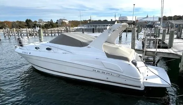 The Image of 2001 Regal 2960 Commodore Cruiser docked at a marina, side view. - 0
