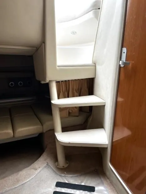 Slide: The Image of Interior of 2001 Regal 2960 Commodore Cruiser with stairs and seating area. - 25