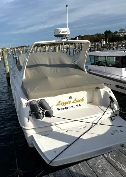 Slide: The Image of 2001 Regal 2960 Commodore Cruiser docked, named "Lizzie Luck," in Westport, MA marina. - 3