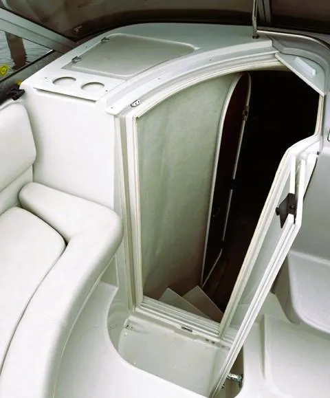 Slide: The Image of 2001 Regal 2960 Commodore Cruiser interior cabin entrance with white seating. - 30