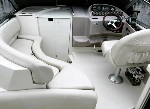 Slide: The Image of 2001 Regal 2960 Commodore Cruiser interior with white seating and control panel. - 31