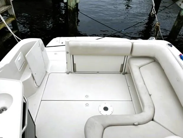 Slide: The Image of 2001 Regal 2960 Commodore Cruiser interior with white seating and water view. - 35