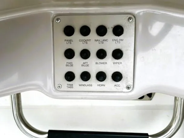 Slide: The Image of Control panel of a 2001 Regal 2960 Commodore Cruiser with labeled switches. - 40