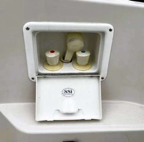 Slide: The Image of Outdoor shower controls on a 2001 Regal 2960 Commodore Cruiser boat. - 42
