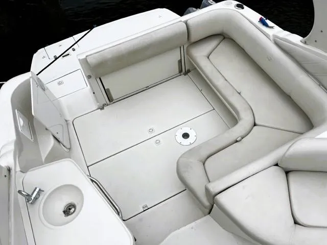Slide: The Image of 2001 Regal 2960 Commodore Cruiser interior with white seating and sink. - 47