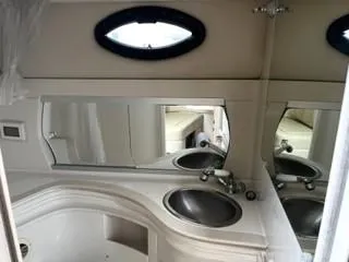 Slide: The Image of 2001 Regal 2960 Commodore Cruiser bathroom with sink and mirror. - 8