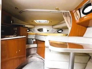 Slide: The Image of Interior of 2001 Regal 2960 Commodore Cruiser with wood cabinetry and seating area. - 9