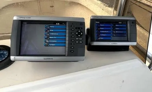 Slide: The Image of Garmin marine GPS devices on a Parker 210 boat dashboard, 1995 model. - 6
