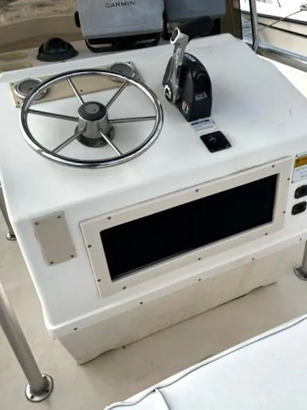 Slide: The Image of Steering console of a 1995 Parker 210 boat with Garmin equipment. - 8