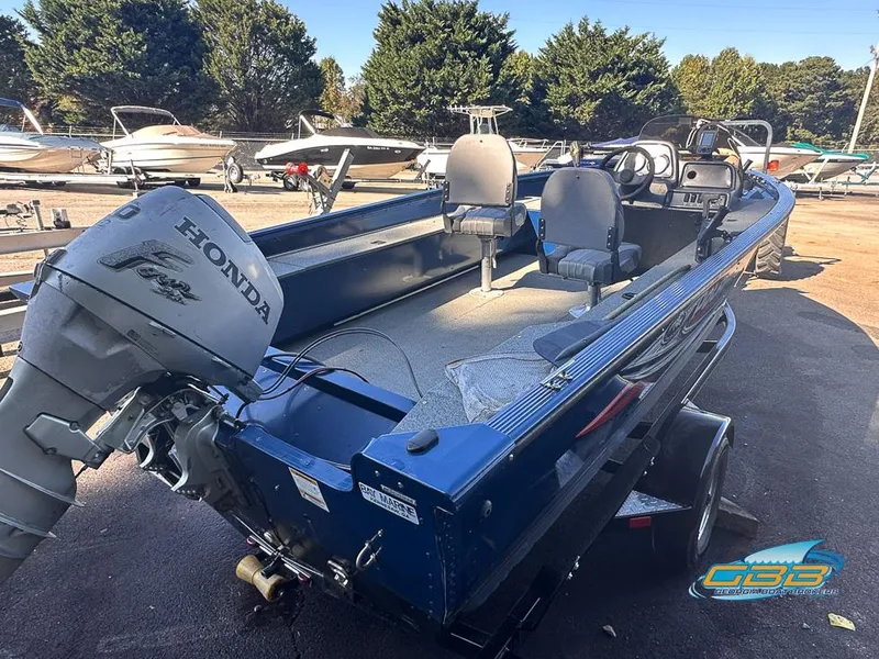 Slide: The Image of 2015 Polar Kraft Outlander 186 SC fishing boat with Honda outboard motor in a marina. - 11