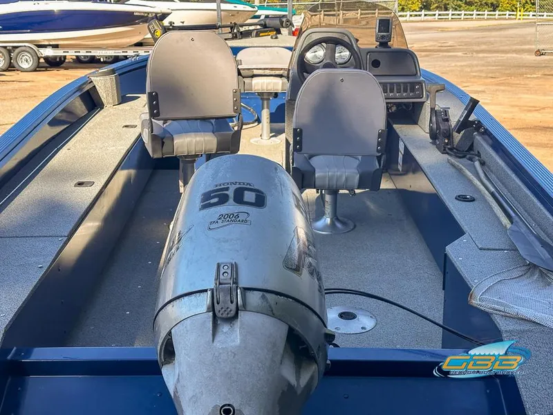 Slide: The Image of 2015 Polar Kraft Outlander 186 SC boat interior with Honda 50 outboard motor. - 12