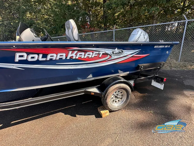 Slide: The Image of 2015 Polar Kraft Outlander 186 SC boat on trailer, side view. - 13