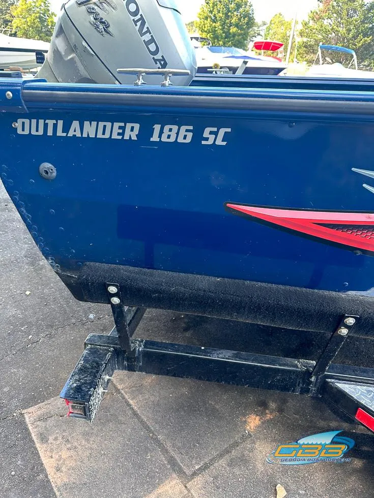 Slide: The Image of 2015 Polar Kraft Outlander 186 SC boat on trailer, rear view. - 17