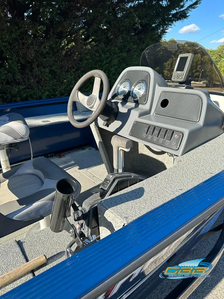 Slide: The Image of 2015 Polar Kraft Outlander 186 SC boat dashboard and seating area. - 4