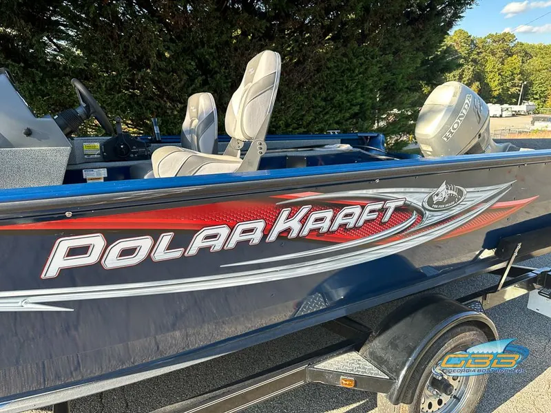 Slide: The Image of 2015 Polar Kraft Outlander 186 SC boat with Honda outboard motor. - 7