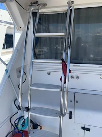 Slide: The Image of Stainless steel ladder on a 2000 Riviera 34 Convertible yacht. - 13