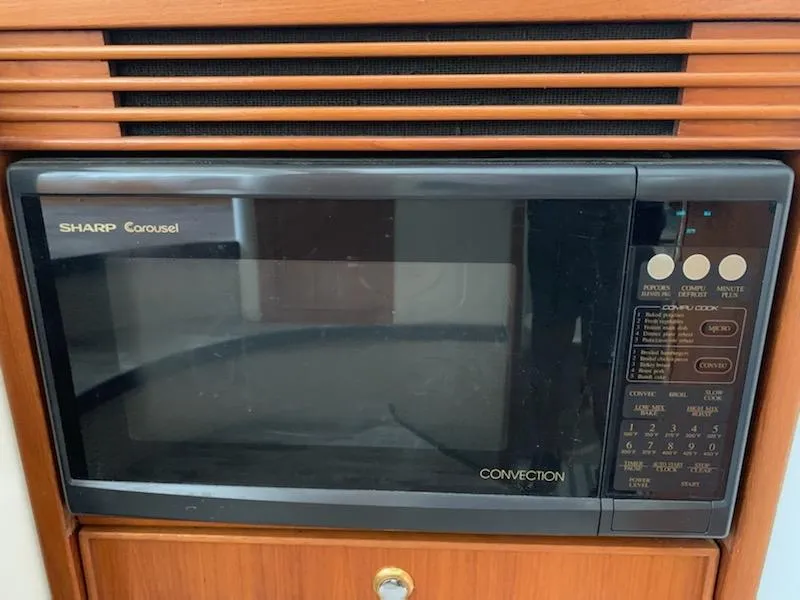 Slide: The Image of Sharp Carousel convection microwave in a 2000 Riviera 34 Convertible boat. - 20