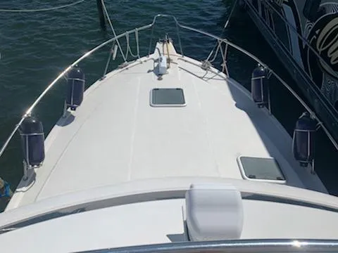 Slide: The Image of Top view of a 2000 Riviera 34 Convertible boat docked in water. - 4