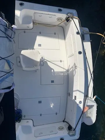 Slide: The Image of 2000 Riviera 34 Convertible boat deck with storage compartments and seating. - 8