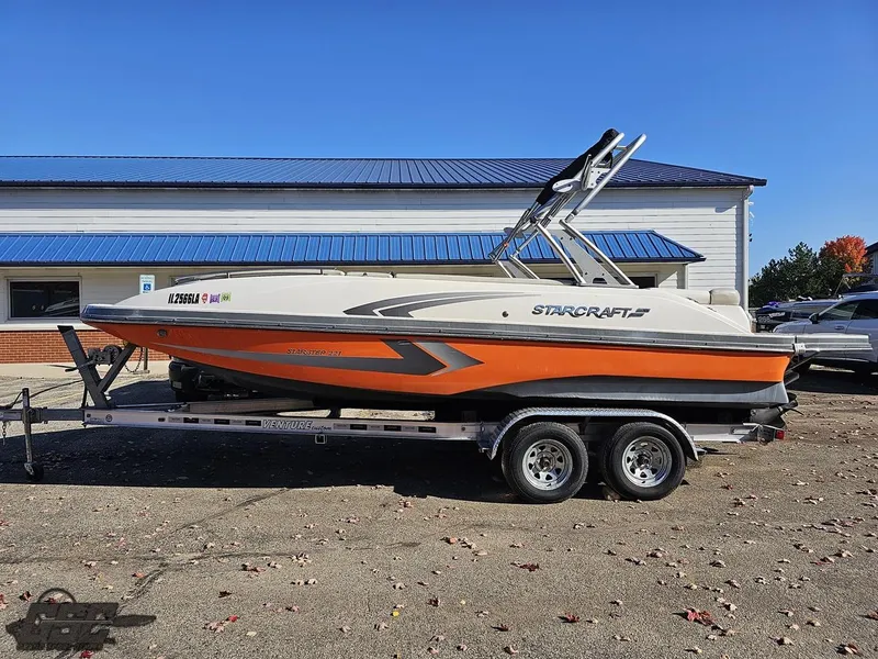 Slide: The Image of 2018 Starcraft Star Step 221 I/O boat on a trailer, side view. - 0